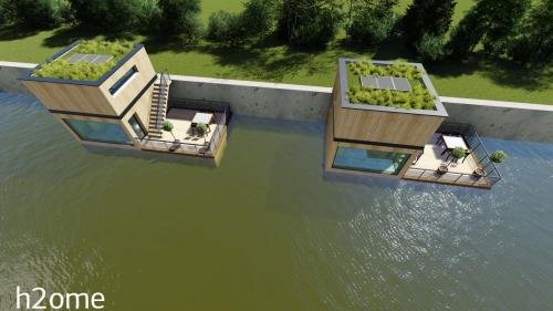 Vue aérienne de deux habitations flottantes avec toitures végétalisées